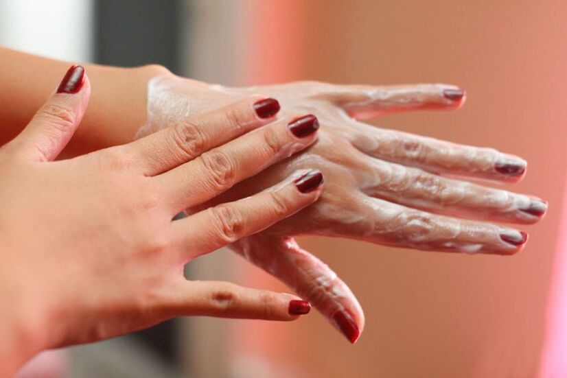 application of cream on the hands for skin rejuvenation